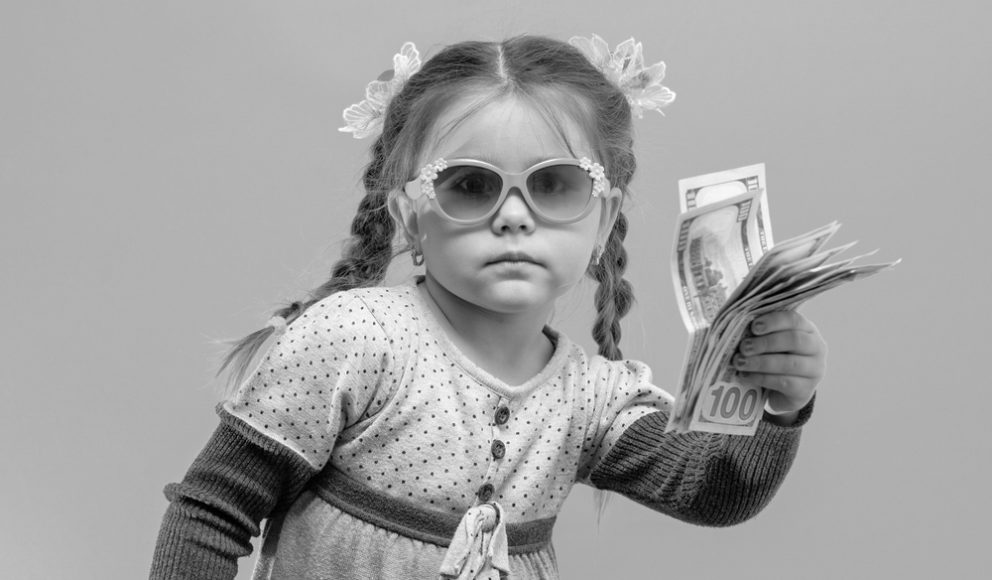 blog cover image of a child holding money