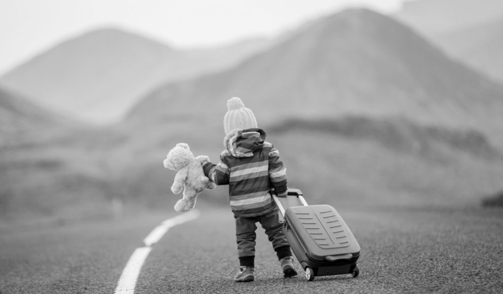 tech talent cover photo. Picture is a child walking with a suitcase.