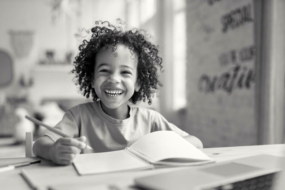Black and white image of a kid studying. Image is the cover for the how to prepare for interview blog
